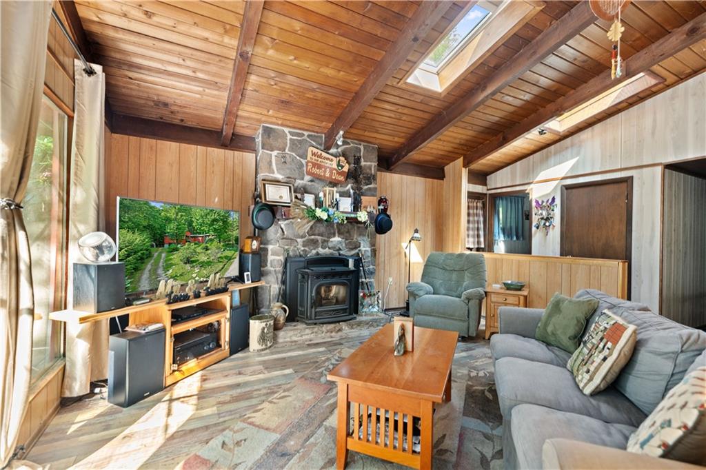 67 Spruce Peak Road Acme, PA 15610 - Photo 7 of 38 a outdoor living space with patio furniture and a fireplace