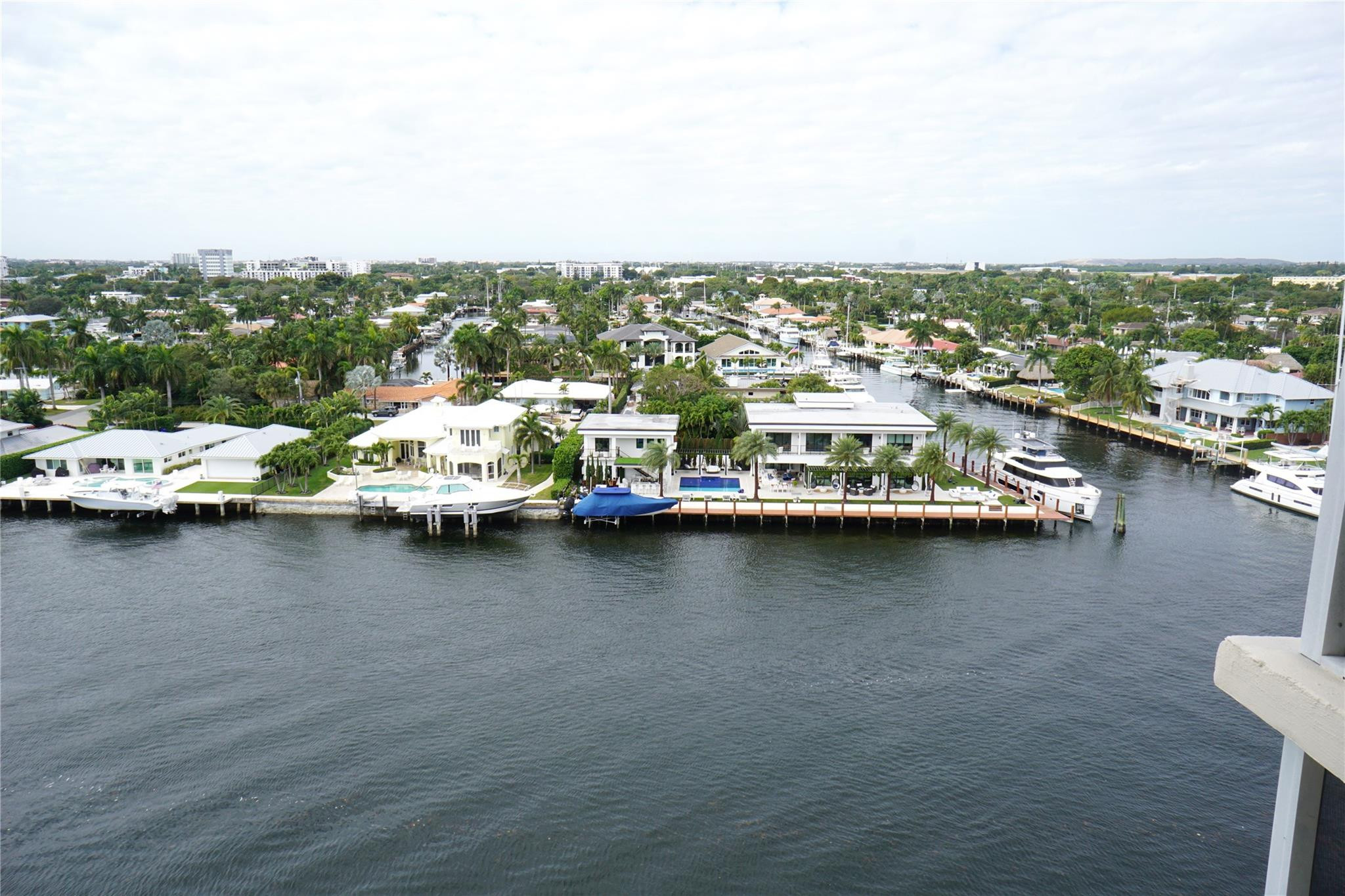 303 North Riverside Drive, Unit PH4 Pompano Beach, FL 33062 - Photo 15 of 52 an aerial view of a city with lawn chairs