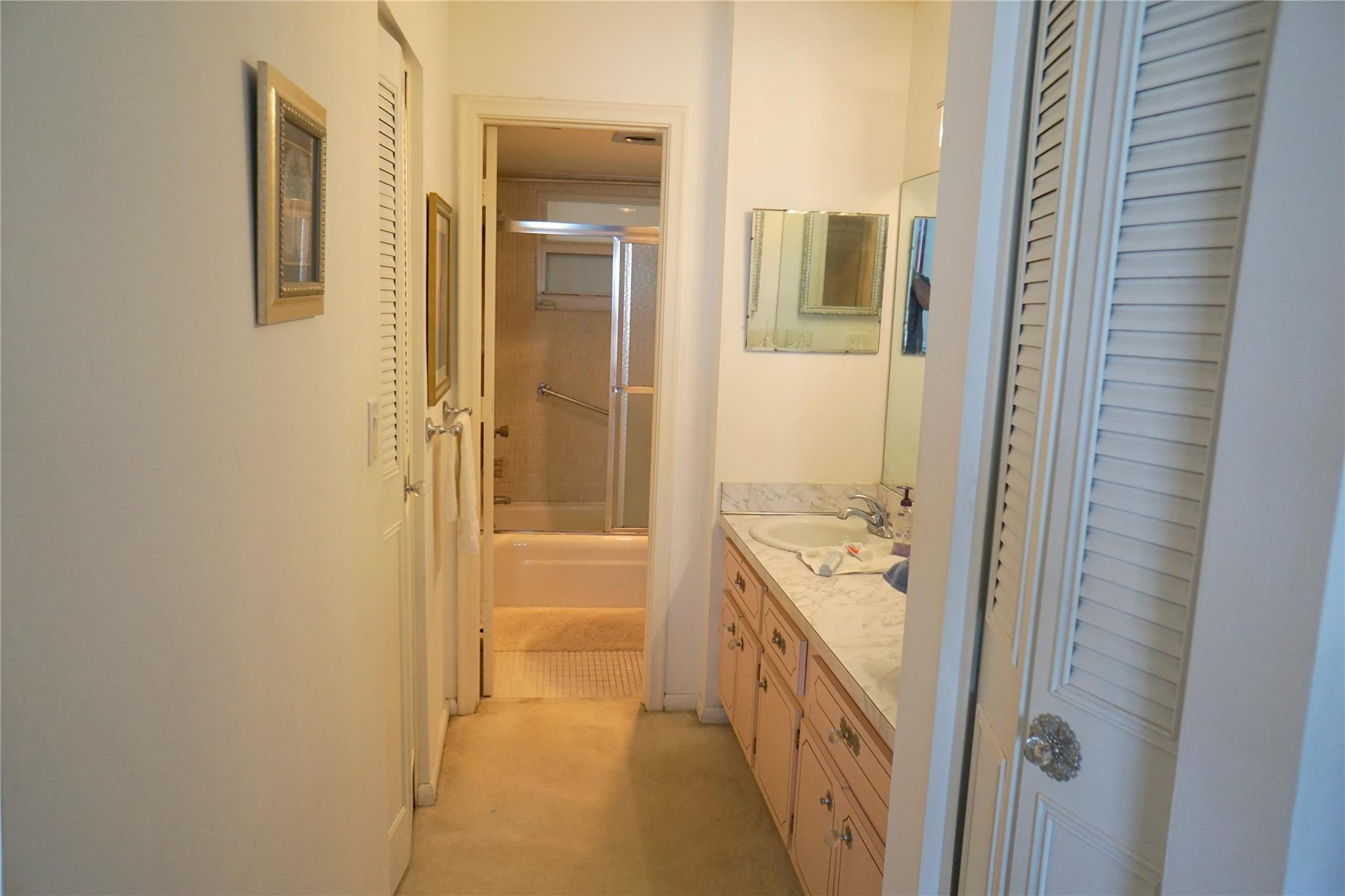 303 North Riverside Drive, Unit PH4 Pompano Beach, FL 33062 - Photo 22 of 52 a bathroom with a tub sink and mirror
