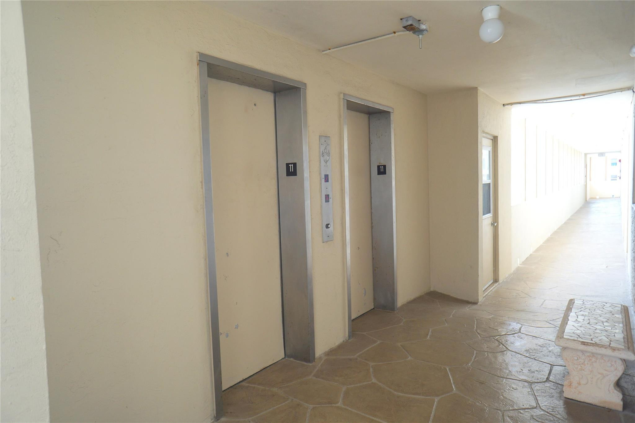 303 North Riverside Drive, Unit PH4 Pompano Beach, FL 33062 - Photo 27 of 52 a view of a hallway to rooms