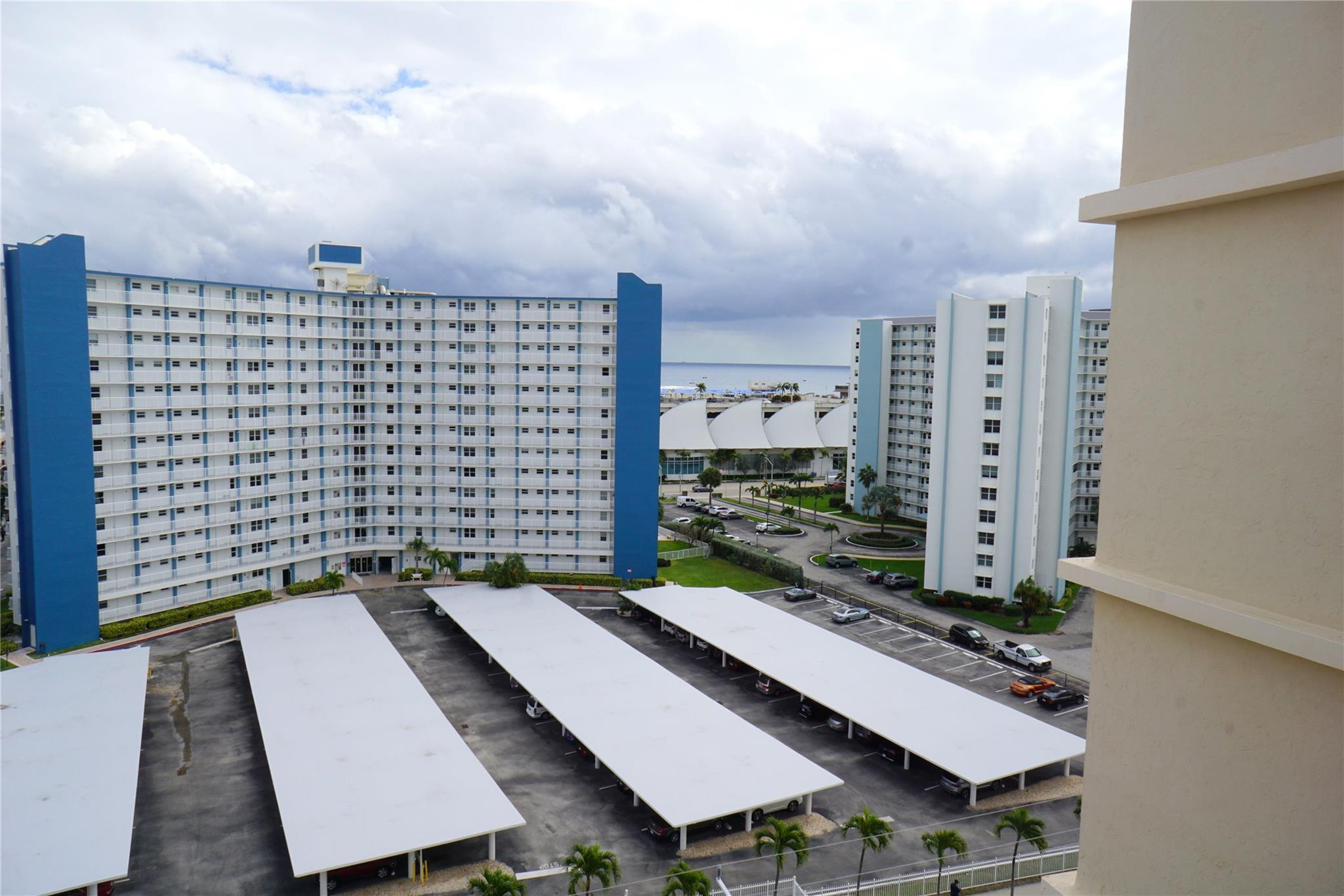 303 North Riverside Drive, Unit PH4 Pompano Beach, FL 33062 - Photo 35 of 52 a view of balcony with a couple of cars parked on road