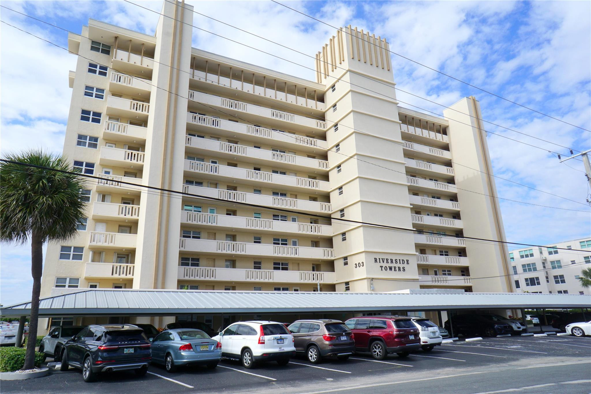 303 North Riverside Drive, Unit PH4 Pompano Beach, FL 33062 - Photo 37 of 52 a front view of a building with parking space