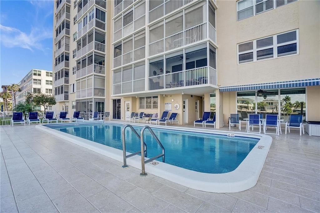 303 North Riverside Drive, Unit PH4 Pompano Beach, FL 33062 - Photo 4 of 52 a view of a swimming pool with sitting space