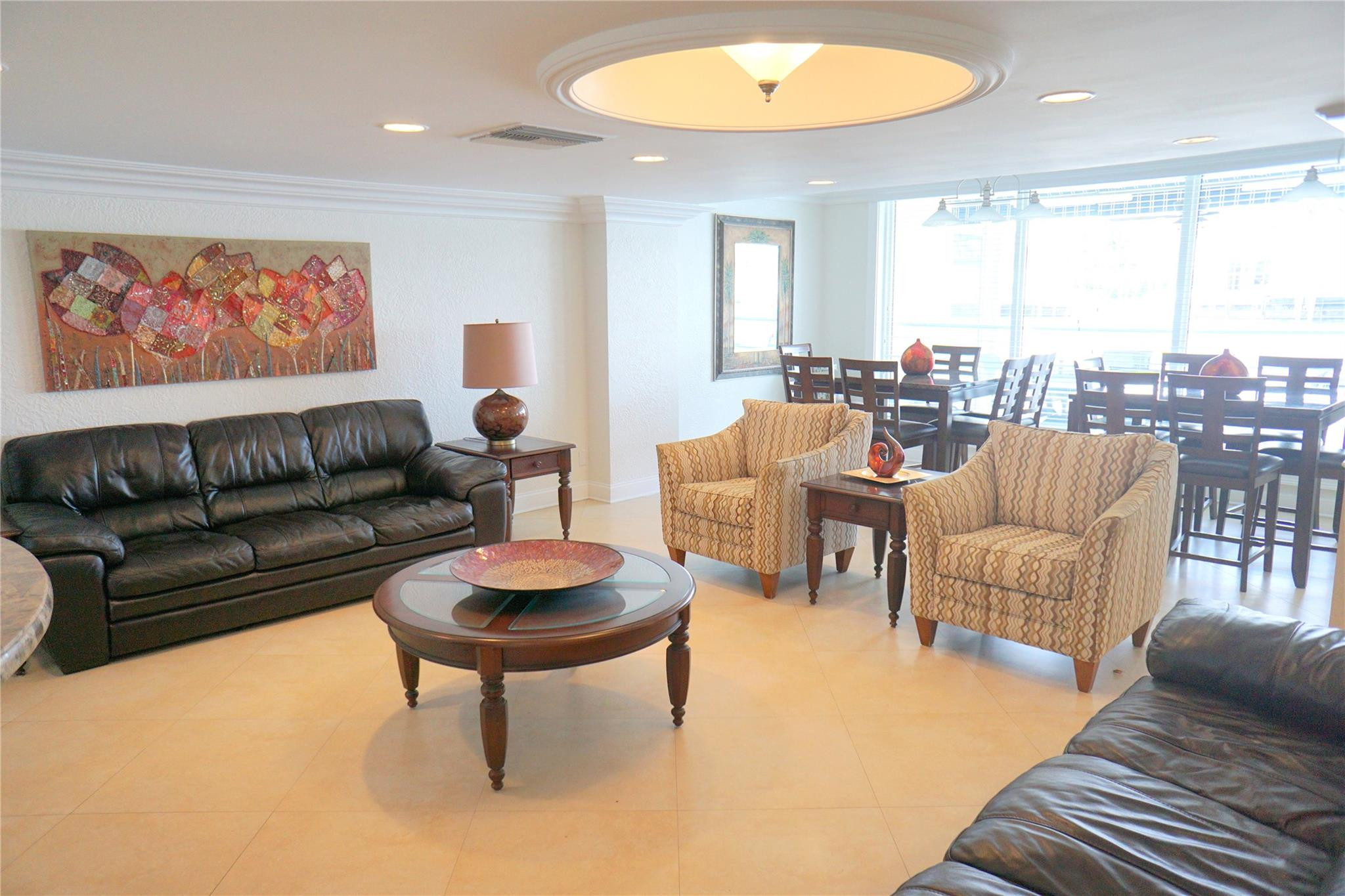 303 North Riverside Drive, Unit PH4 Pompano Beach, FL 33062 - Photo 44 of 52 a living room with furniture and a large window