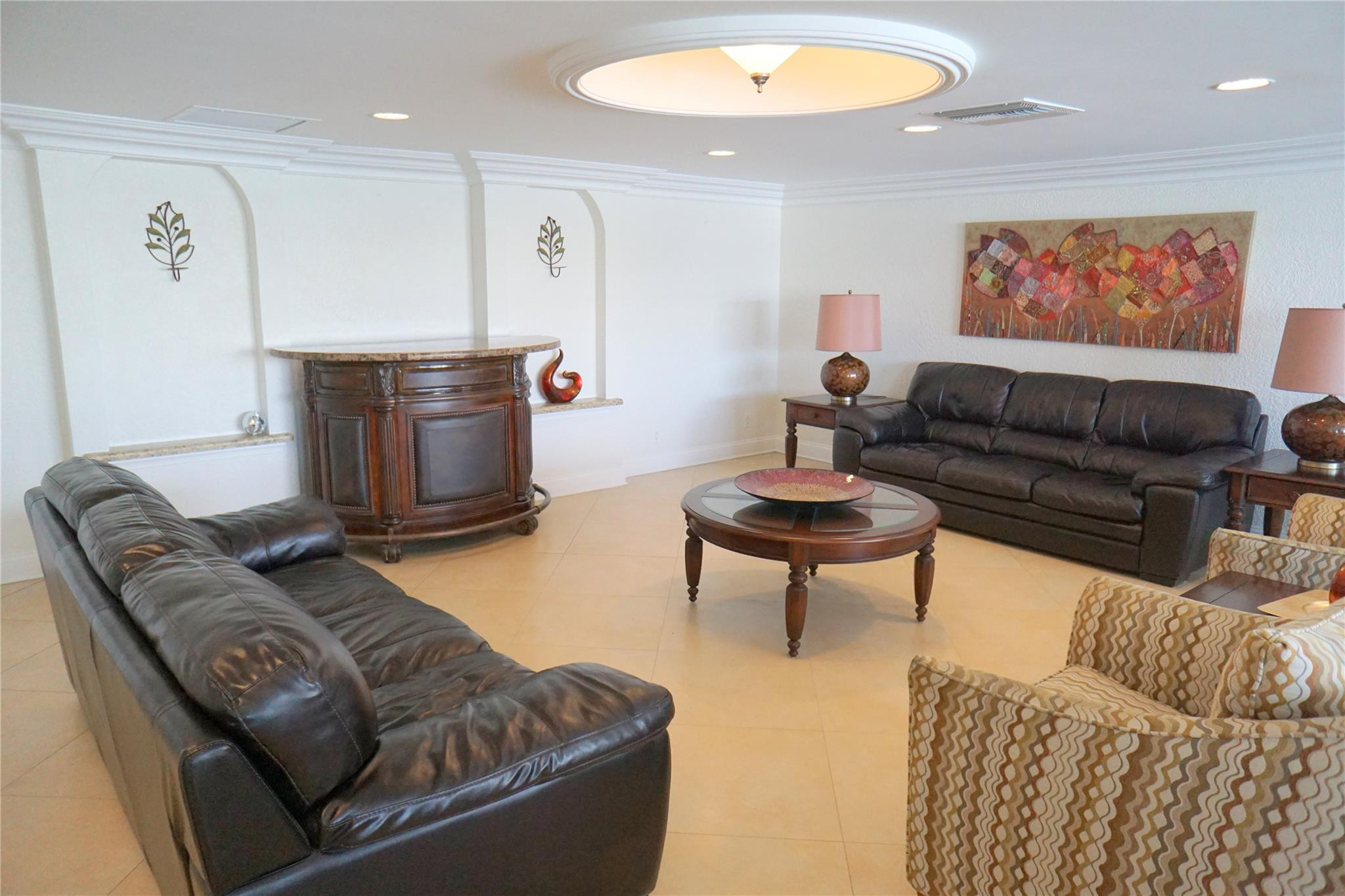 303 North Riverside Drive, Unit PH4 Pompano Beach, FL 33062 - Photo 45 of 52 a living room with furniture and a flat screen tv