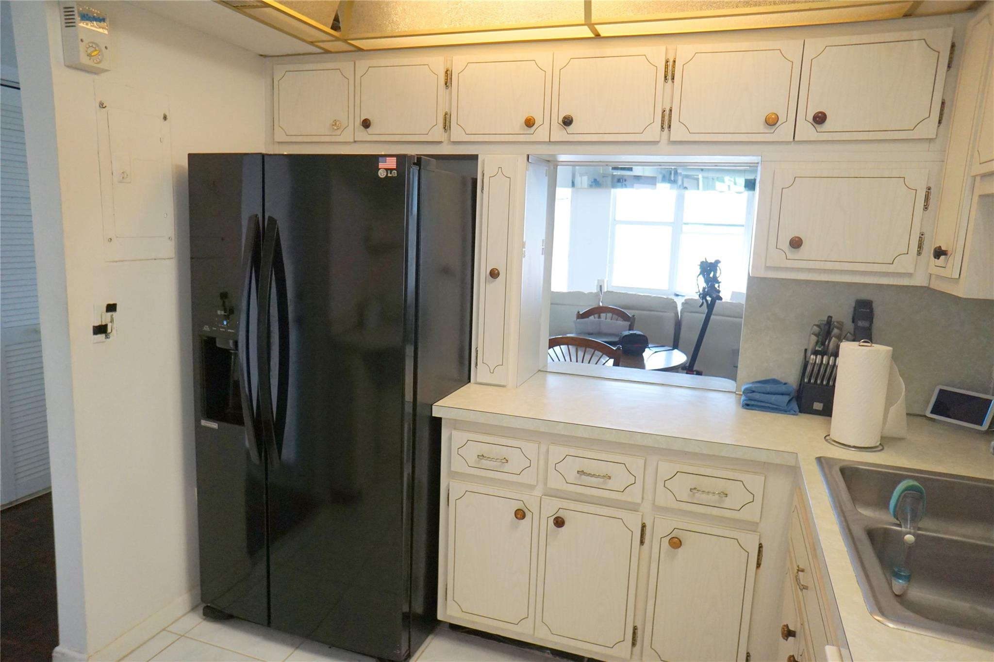 303 North Riverside Drive, Unit PH4 Pompano Beach, FL 33062 - Photo 9 of 52 a kitchen with stainless steel appliances a refrigerator and cabinets