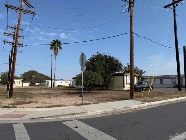 a view of a street with a building in the background