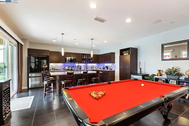 a room with table tennis pool table with furniture