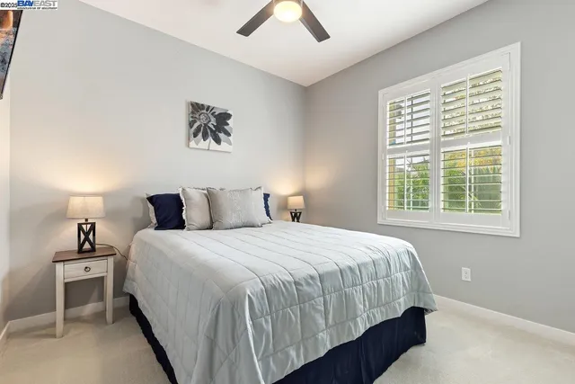 a bedroom with bed and window