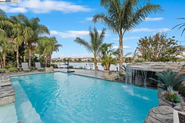 a view of a swimming pool with a table and chairs