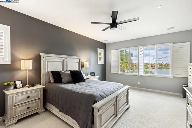 a bedroom with a large bed and a window