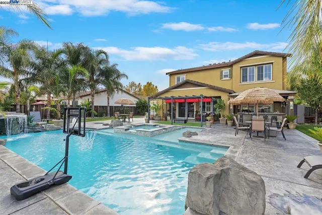 a view of a swimming pool with sitting area