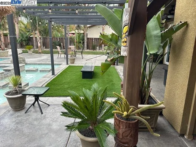 a view of a backyard with sitting area