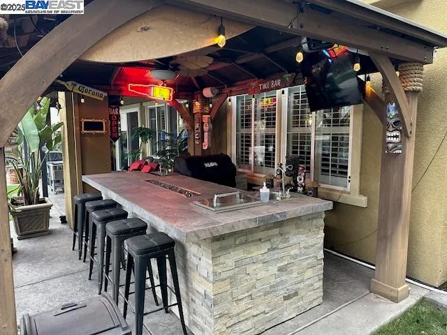 a view of a chairs and table in a patio