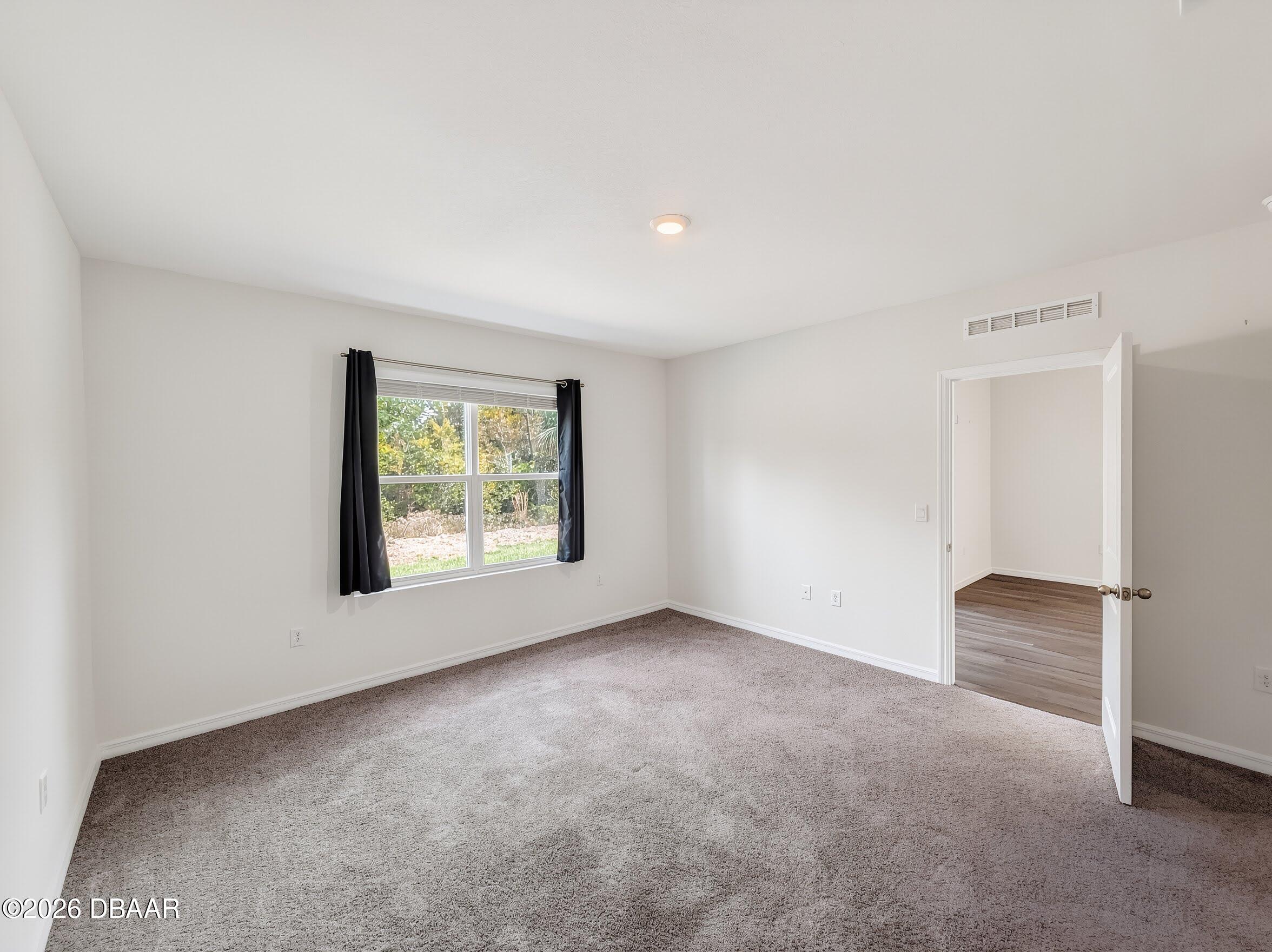 982 Commons Way Port Port Orange, FL 32129 - Photo 5 of 12 11-interiorprimarybedroom1