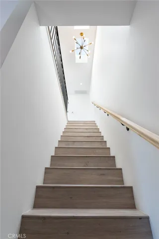 a view of a hallway with stairs