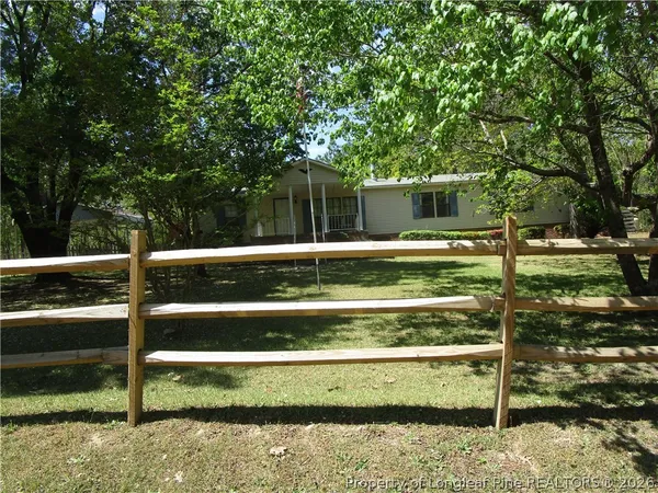a view of backyard with swimming pool