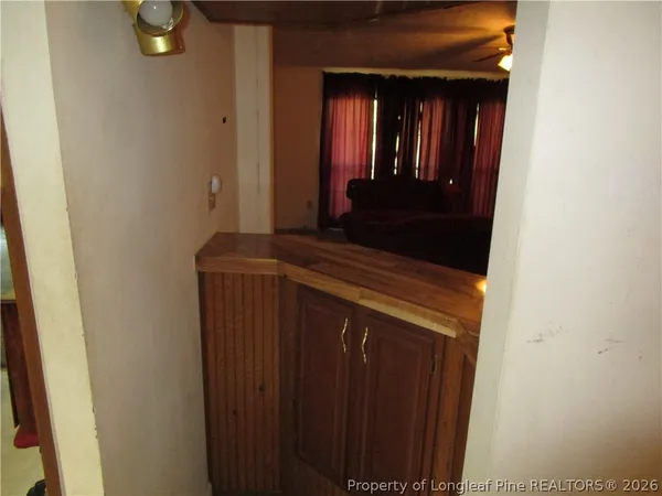 a view of hallway with granite countertop