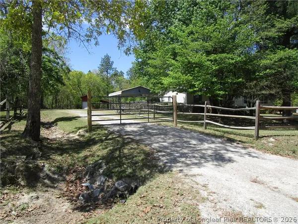 a view of outdoor space with deck and yard