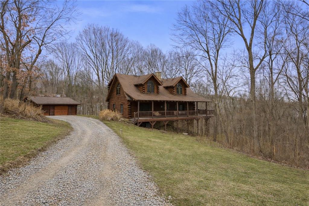70 Economy Grade Road Coraopolis, PA 15108 - Photo 1 of 45 a view of a house with a yard covered by trees