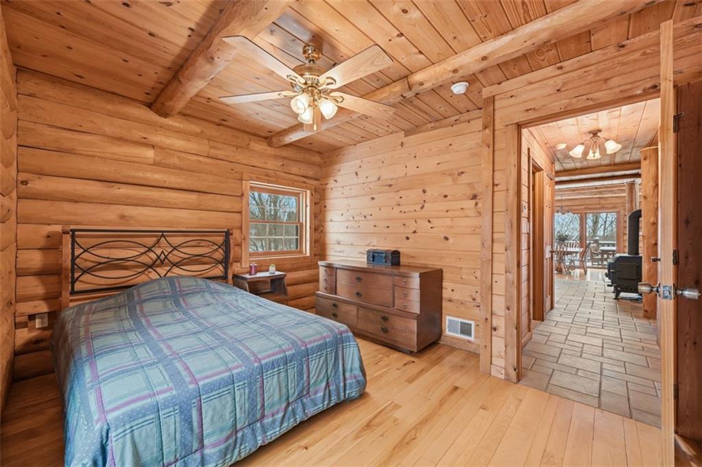 70 Economy Grade Road Coraopolis, PA 15108 - Photo 20 of 45 a bedroom with a bed and a chandelier