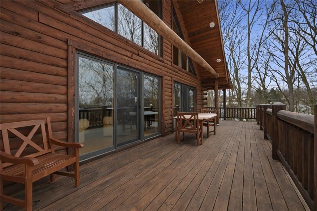 70 Economy Grade Road Coraopolis, PA 15108 - Photo 37 of 45 a view of a patio with table and chairs with wooden floor and fence