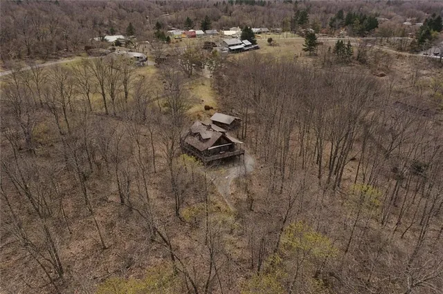 a view of a house with a yard and garage