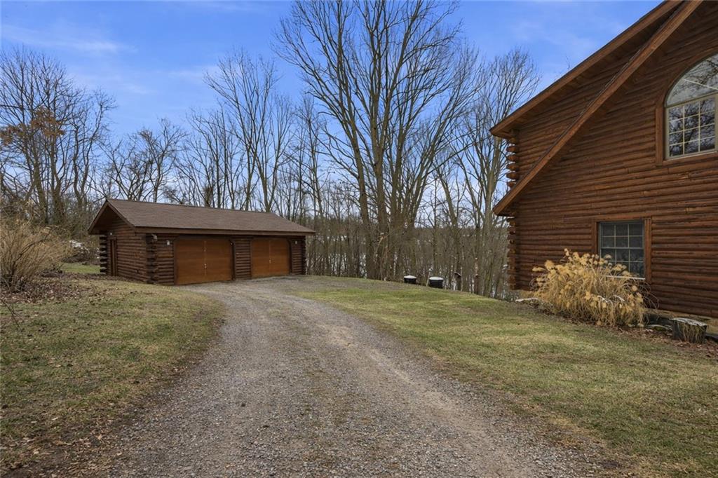 70 Economy Grade Road Coraopolis, PA 15108 - Photo 44 of 45 a view of a house with a yard and garage