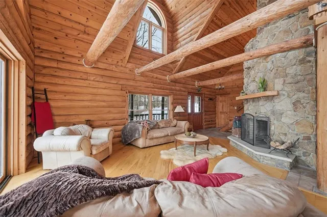 a bedroom with furniture and a fireplace