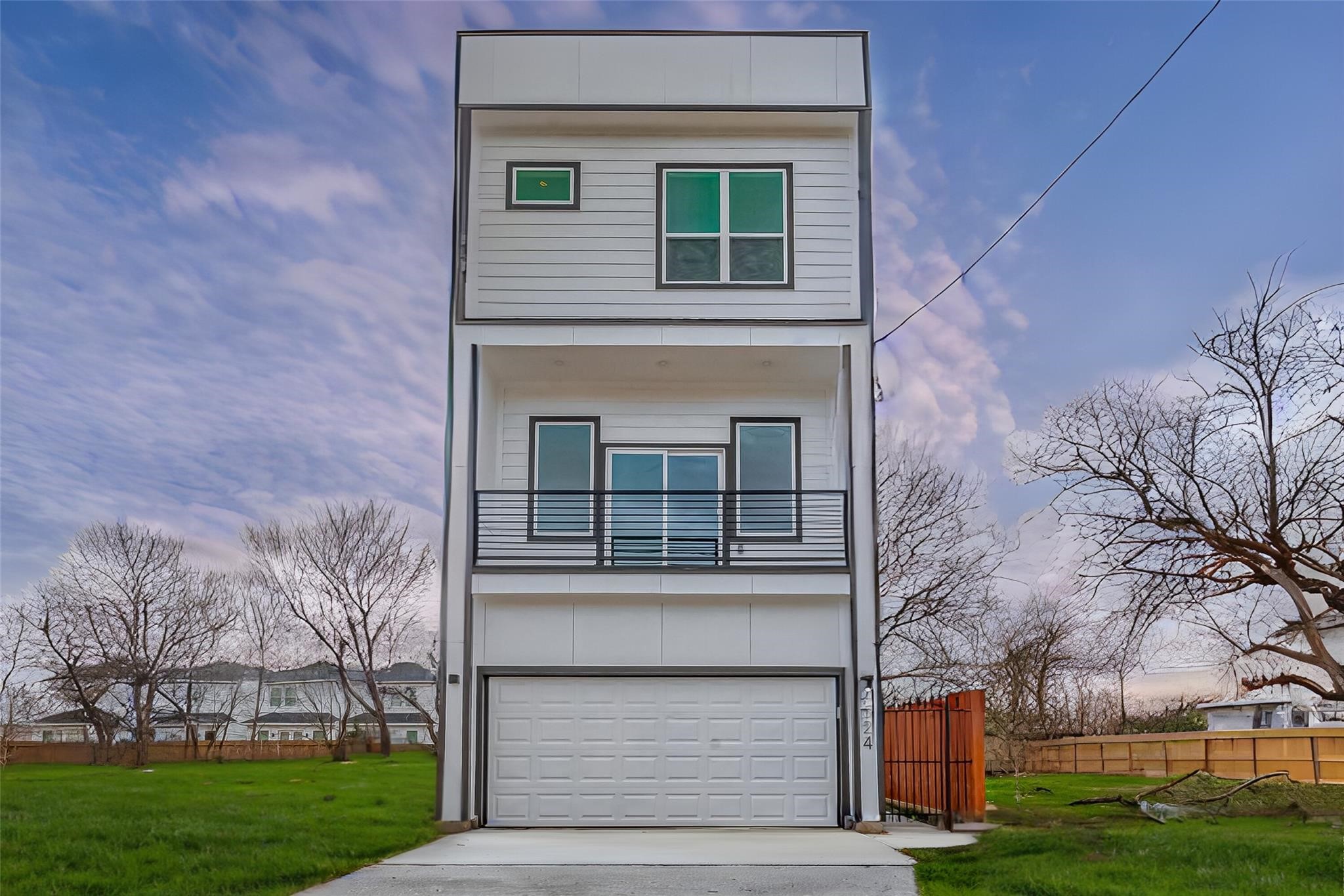 front view of a house with a yard