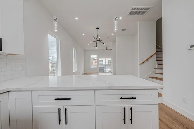 a view of a kitchen with a sink and dishwasher