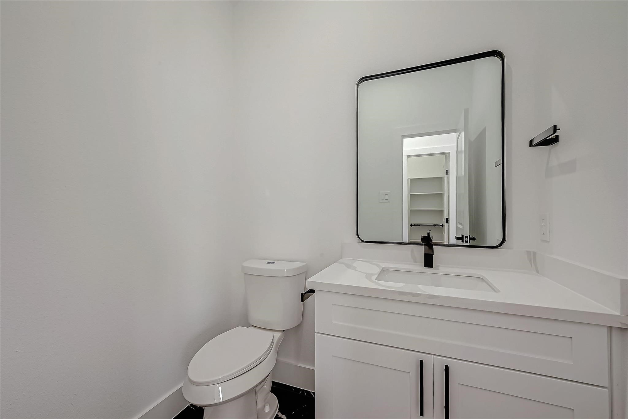 3624 Goodhope Street Houston, TX 77021 - Photo 19 of 32 a bathroom with a toilet sink and mirror