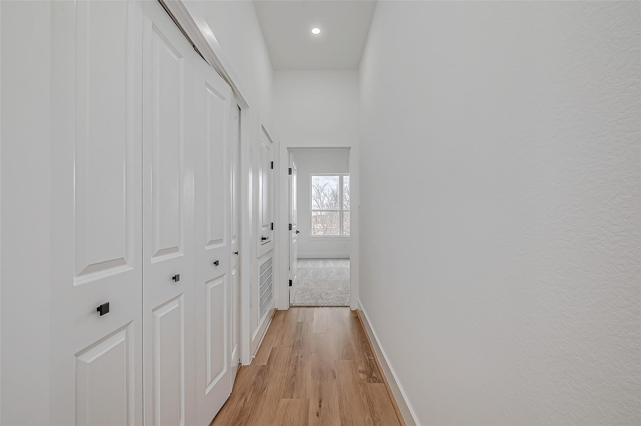 3624 Goodhope Street Houston, TX 77021 - Photo 20 of 32 a view of a hallway with wooden floor and closet area