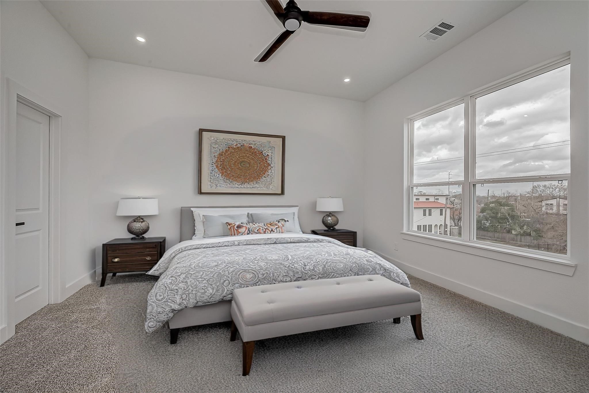 3624 Goodhope Street Houston, TX 77021 - Photo 21 of 32 a bedroom with a bed and a large window