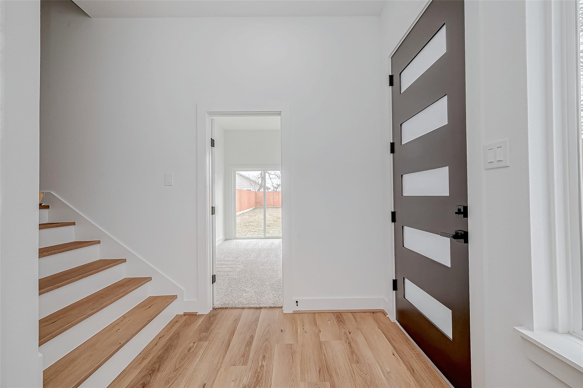 3624 Goodhope Street Houston, TX 77021 - Photo 3 of 32 a view of a room with wooden floor and staircase