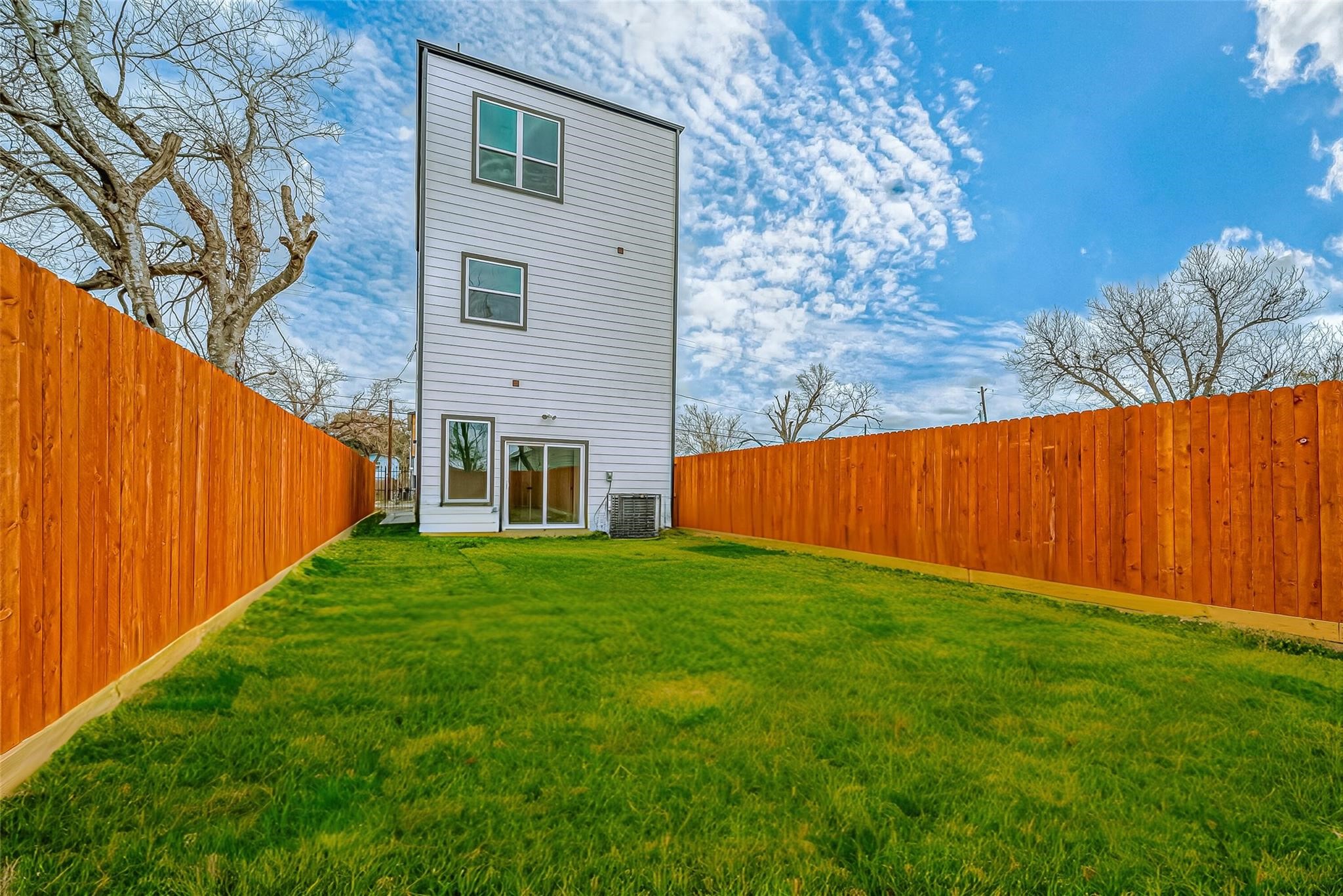 3624 Goodhope Street Houston, TX 77021 - Photo 32 of 32 a view of a backyard with plants and wooden fence