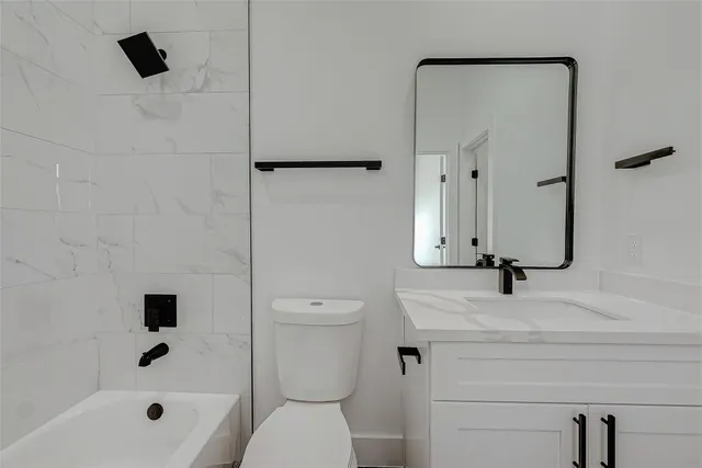 a bathroom with a sink toilet a shower and bathtub