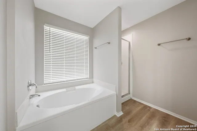 a white bath tub sitting next to a window