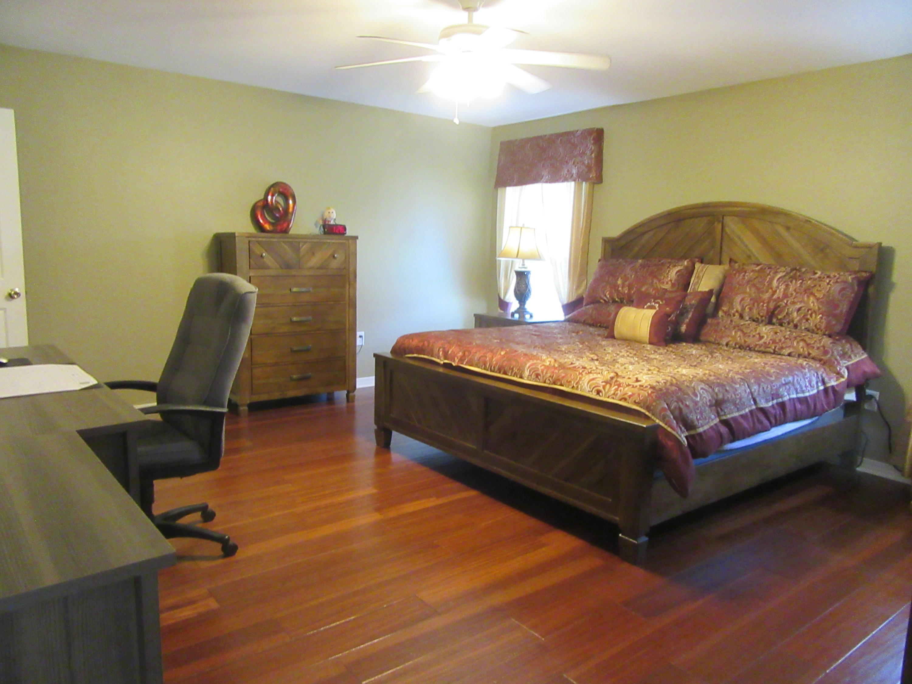 5968 Buckward Road Baker, FL 32531 - Photo 17 of 52 a bedroom with a bed and a window
