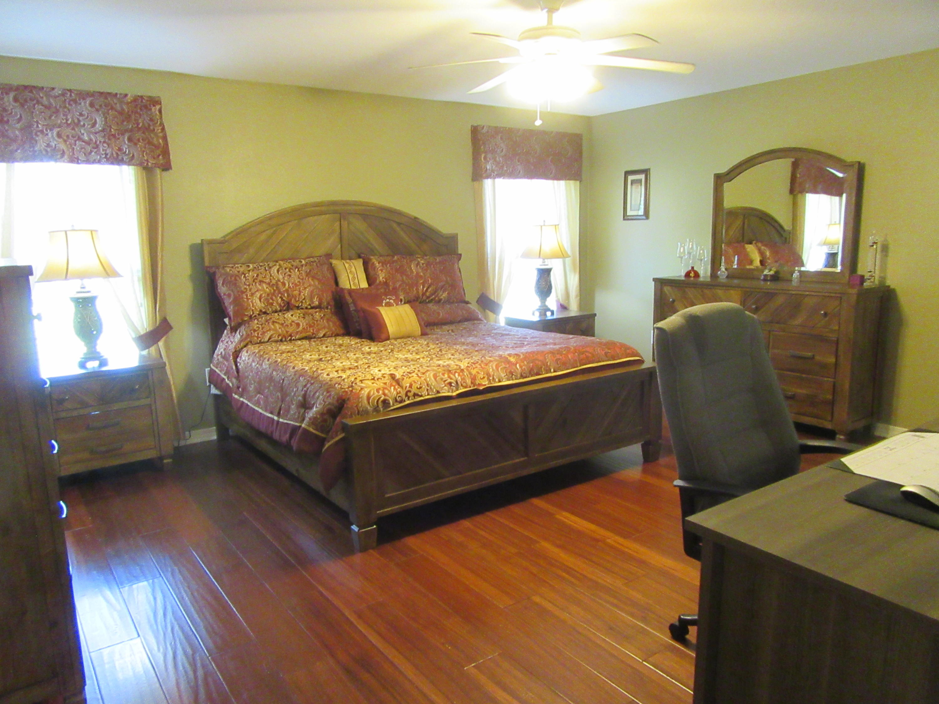 5968 Buckward Road Baker, FL 32531 - Photo 18 of 52 a bedroom with a bed and window