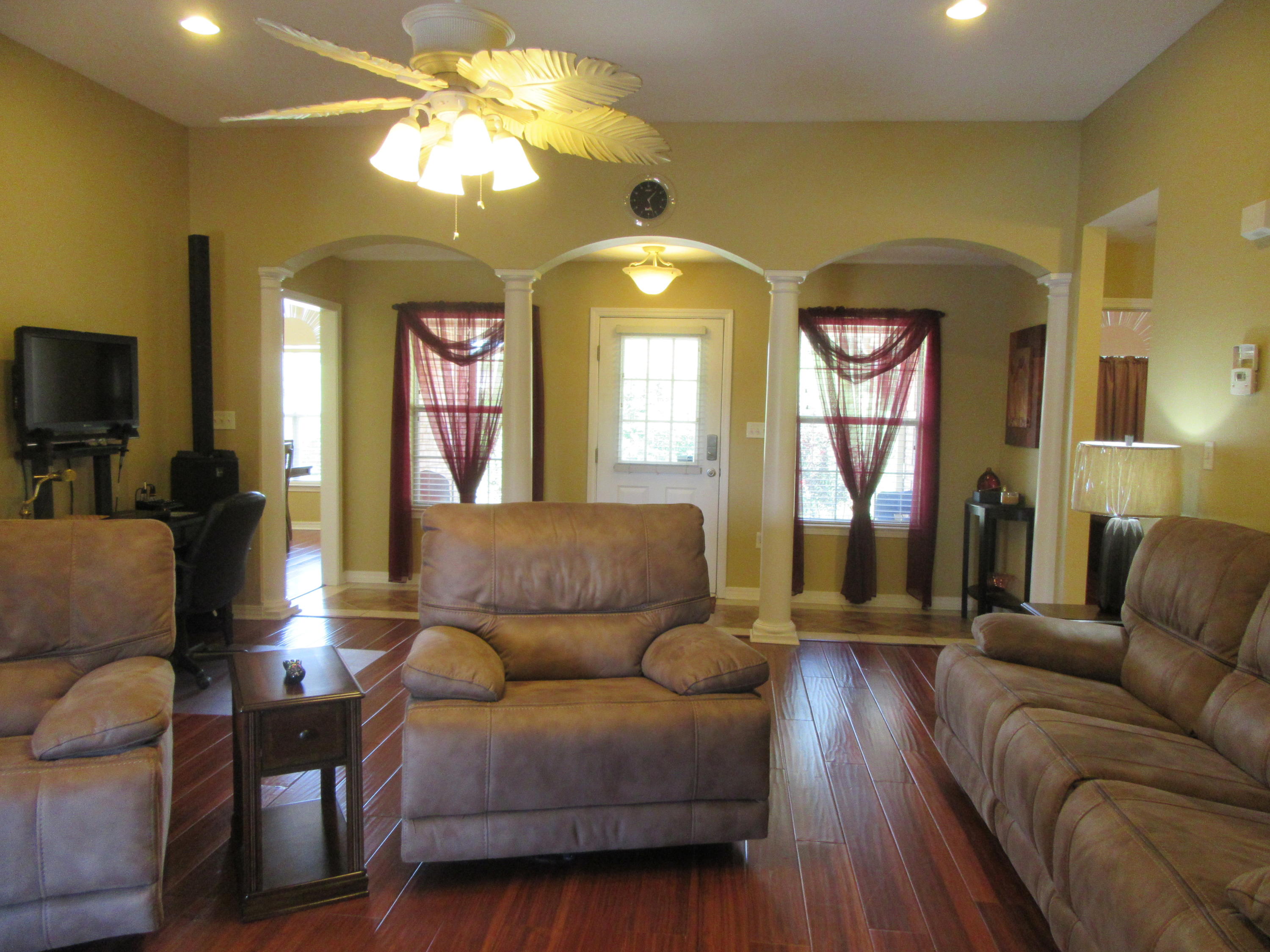 5968 Buckward Road Baker, FL 32531 - Photo 26 of 52 a living room with furniture and a large window