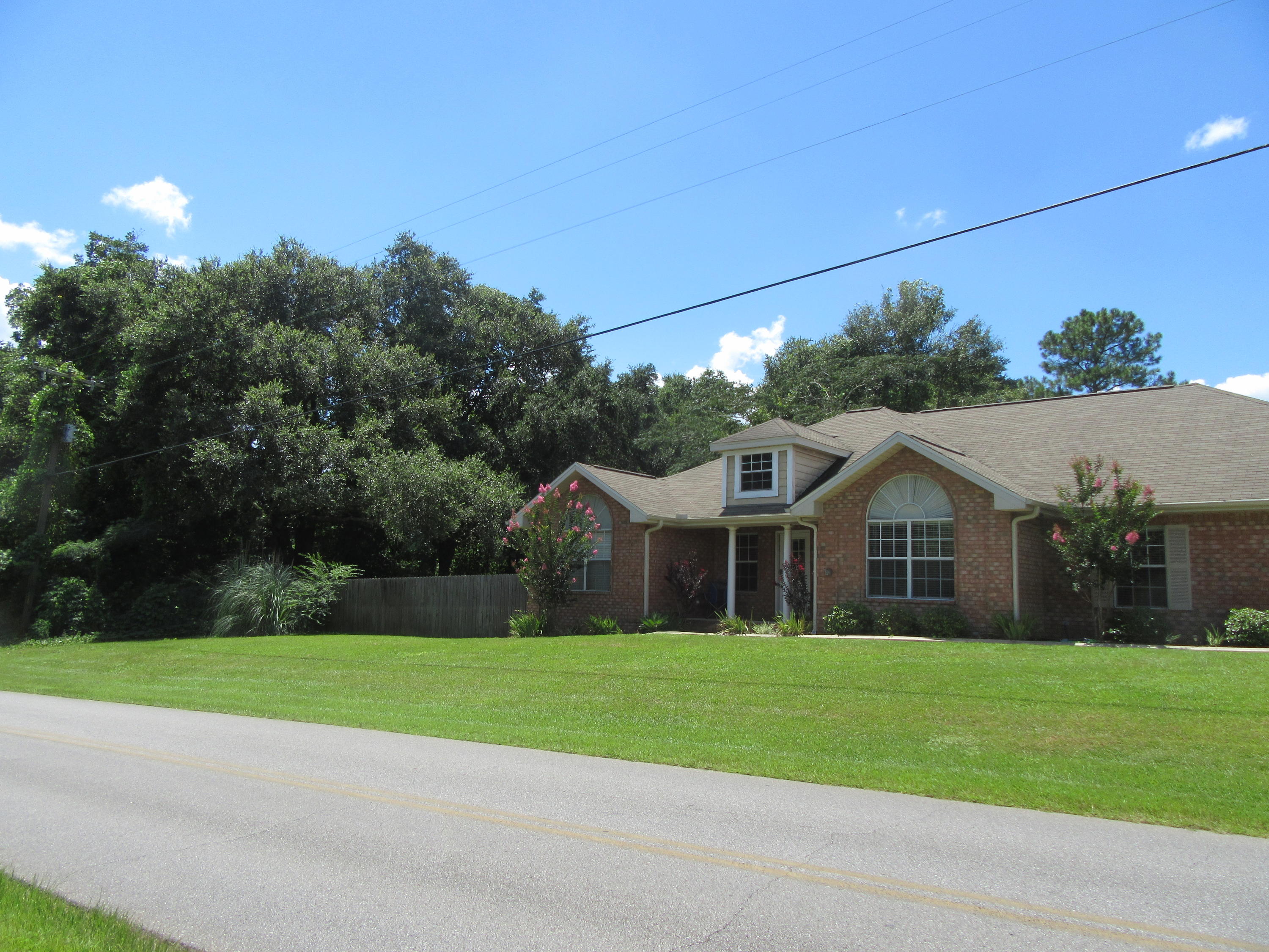 5968 Buckward Road Baker, FL 32531 - Photo 4 of 52 a front view of house with yard and green space
