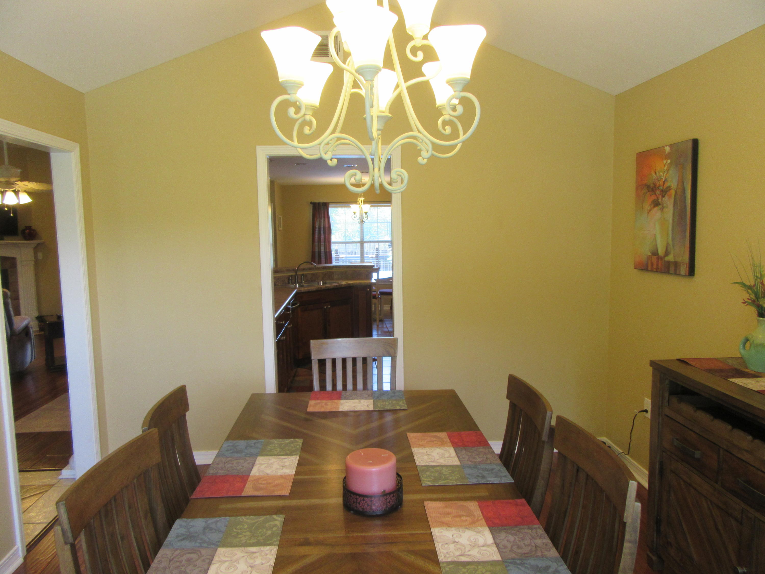 5968 Buckward Road Baker, FL 32531 - Photo 31 of 52 a view of a dining room with furniture and a chandelier