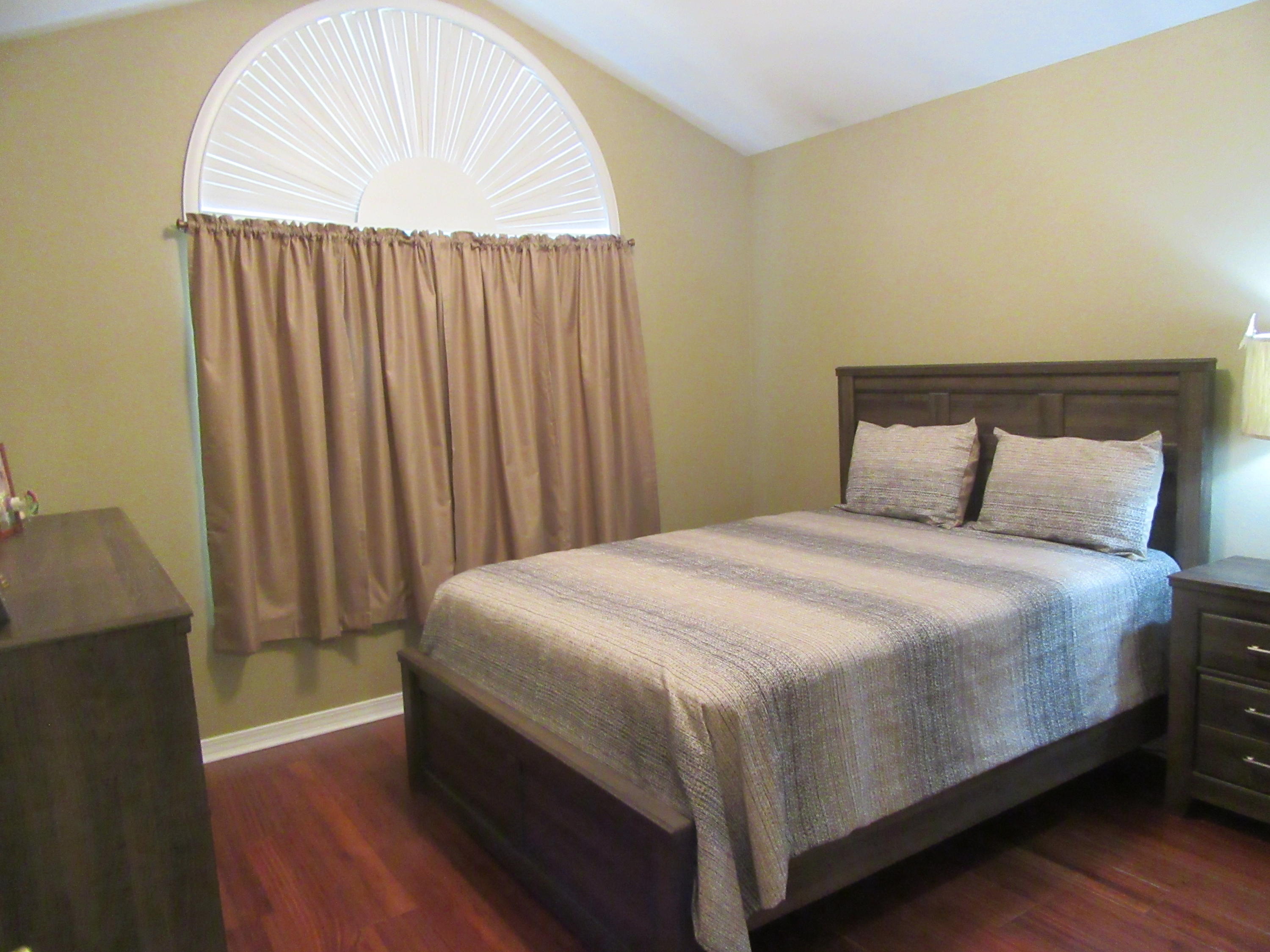 5968 Buckward Road Baker, FL 32531 - Photo 34 of 52 a bedroom with a bed and a window