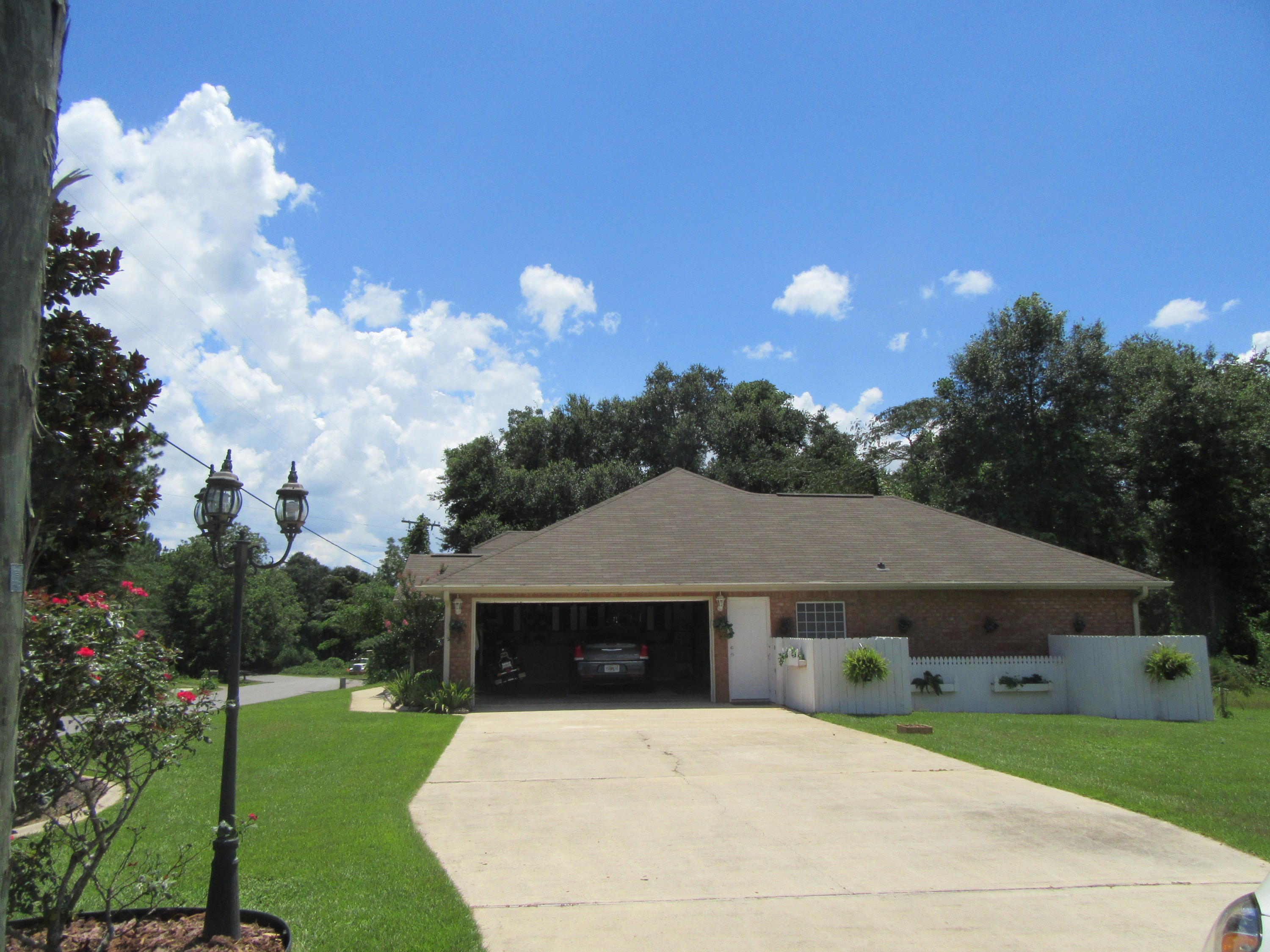 5968 Buckward Road Baker, FL 32531 - Photo 5 of 52 a front view of a house with garden