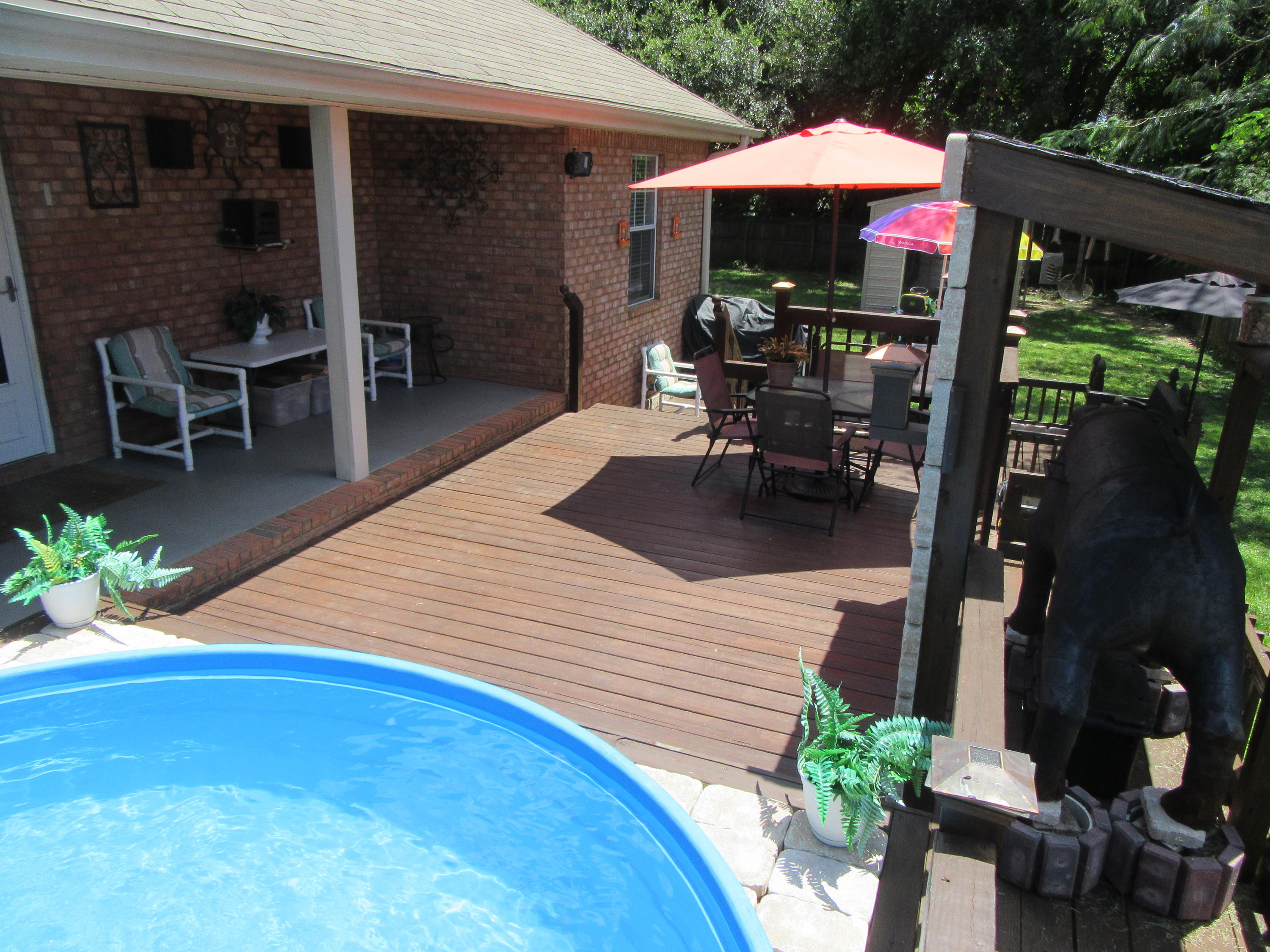 5968 Buckward Road Baker, FL 32531 - Photo 44 of 52 a patio with table and chairs and potted plants