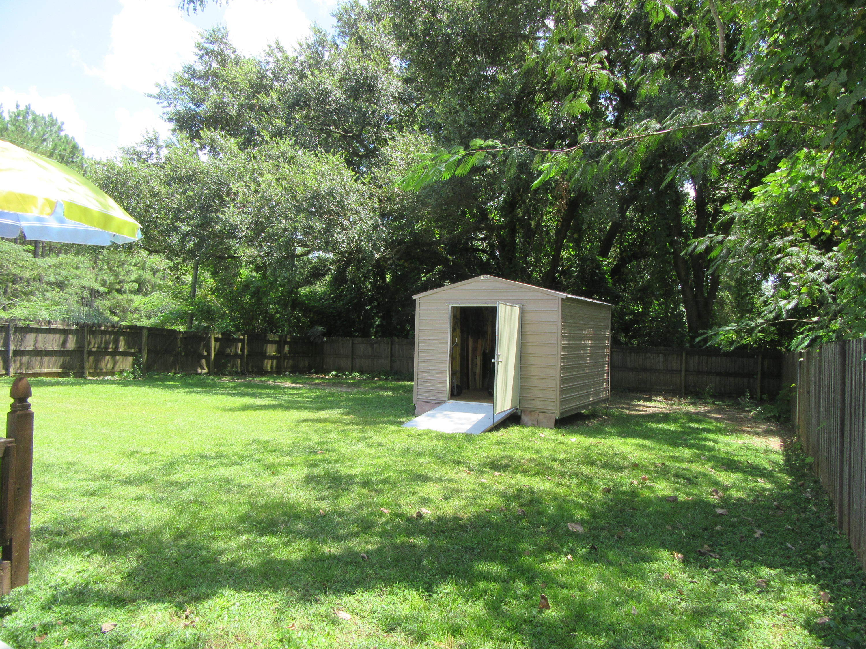 5968 Buckward Road Baker, FL 32531 - Photo 51 of 52 a view of a back yard of the house