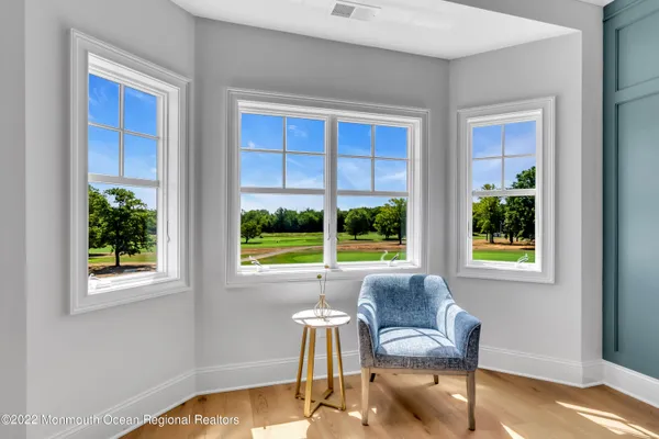 a kitchen with kitchen island a stove a refrigerator a sink dishwasher with a dining table and chairs