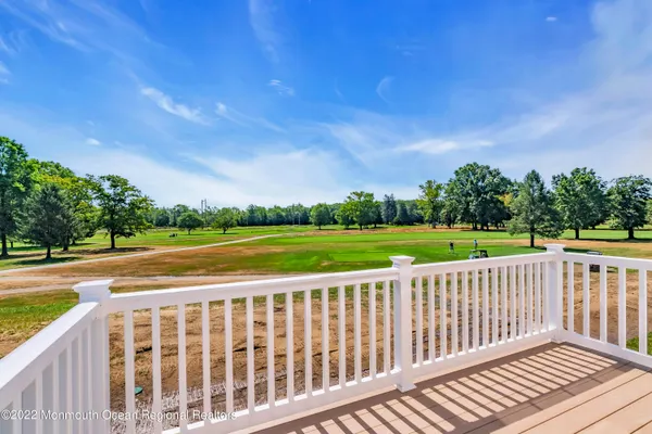 an aerial view of a house with a big yard