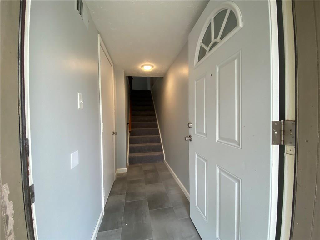 111 Gringo Independence Road Aliquippa, PA 15001 - Photo 22 of 25 Entry hall with brand new LVT leading to carpeted stairs to main floor